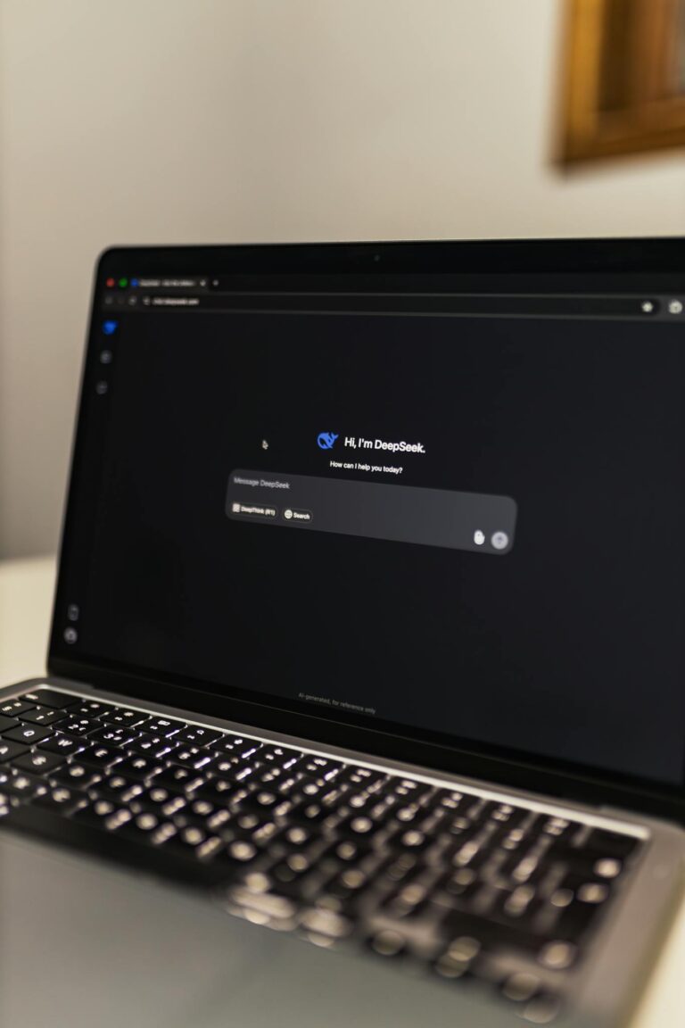 Close-up view of an AI chat interface on a laptop screen in a dimly lit room.